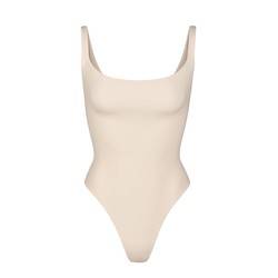 The Skims Fits Everybody Square Neck Bodysuit is much more affordable when ordered from the United States