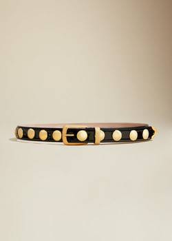 Securing the Khaite Gold Hammered Belt in Switzerland requires a specific logistical framework